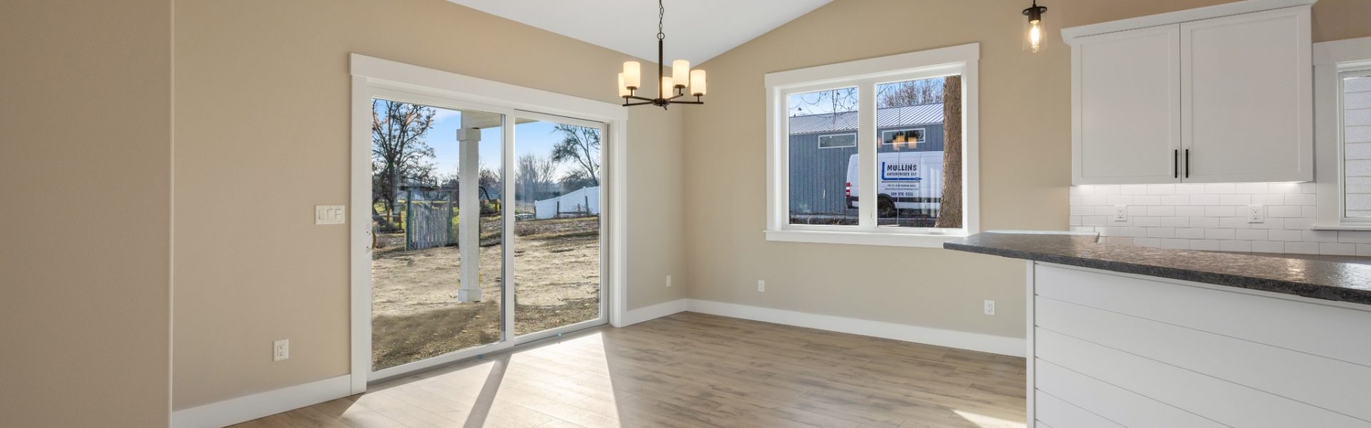 Dining nook with bright windows