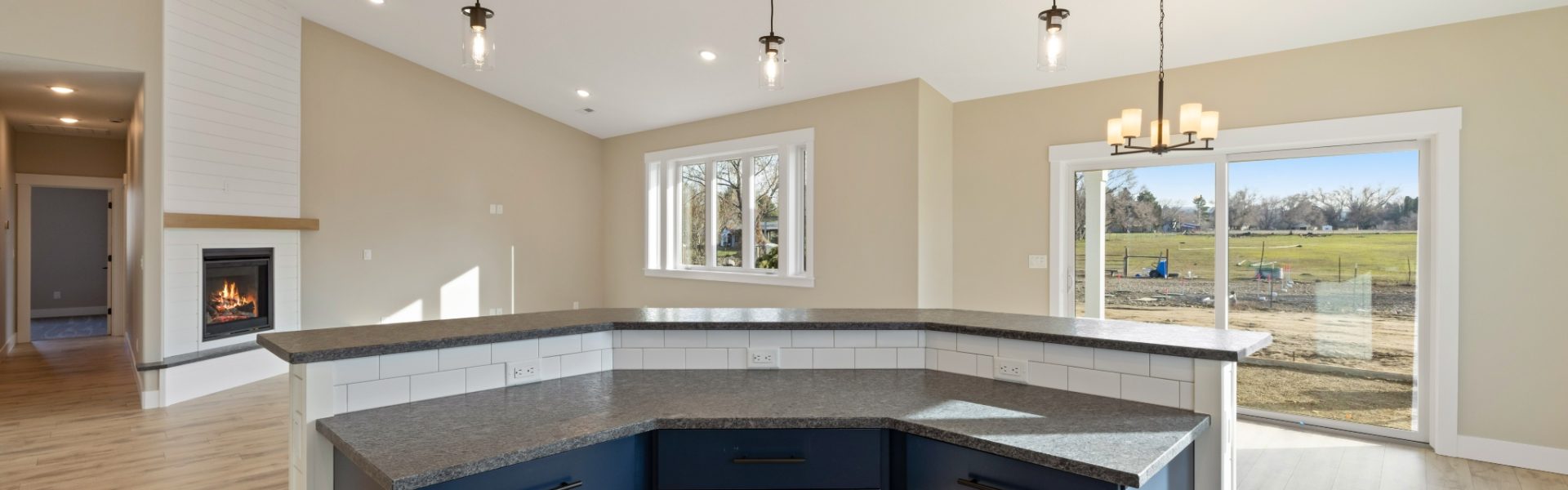 Curved island opening up to large great room and dining noook