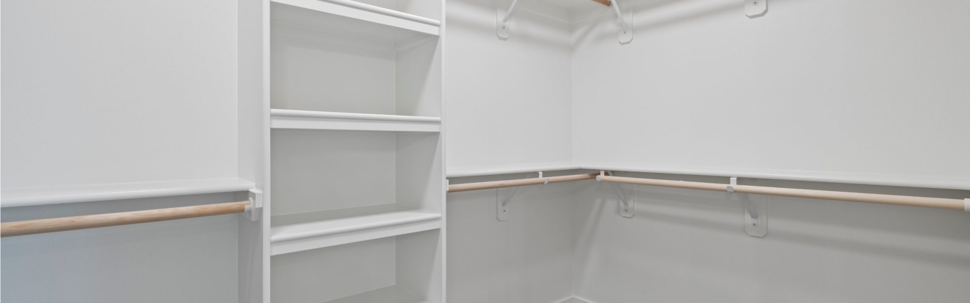 Big walk in closet with built in shelves