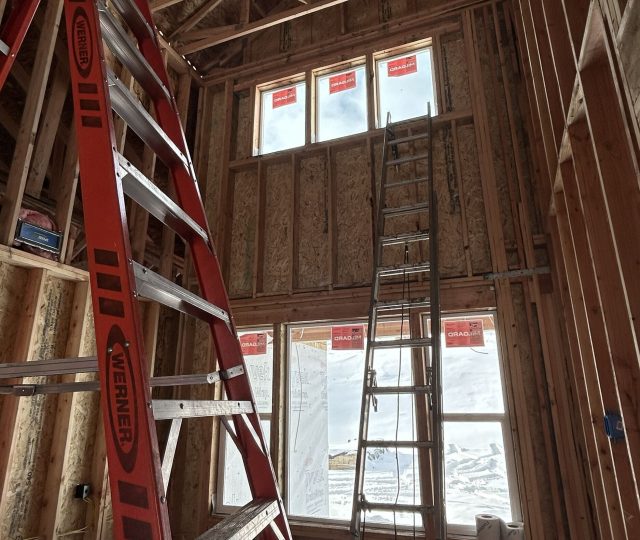 Tall dormer in entryway of custom home in framing
