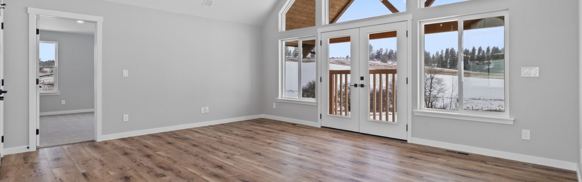 Great Room with Picture Windows in Custom Summit floor plan by Lexar Homes Spokane