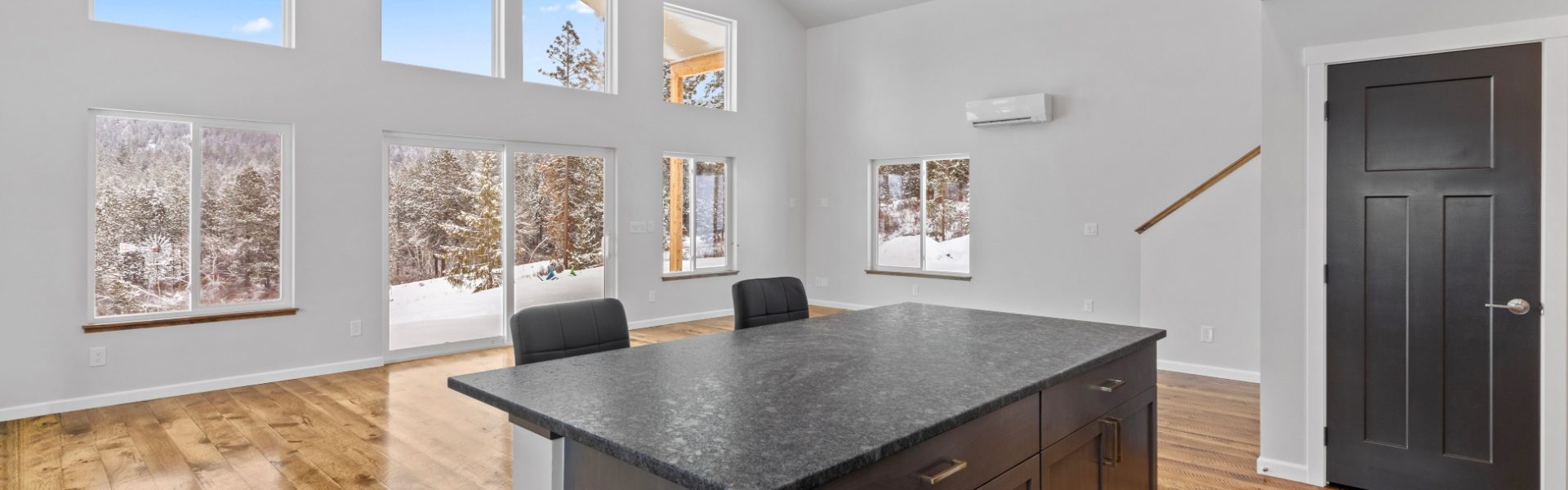 Custom home kitchen and great room in cabin style home